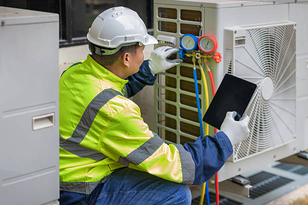 Professional Emergency Hvac Repair technician working in Morrisonville, NY